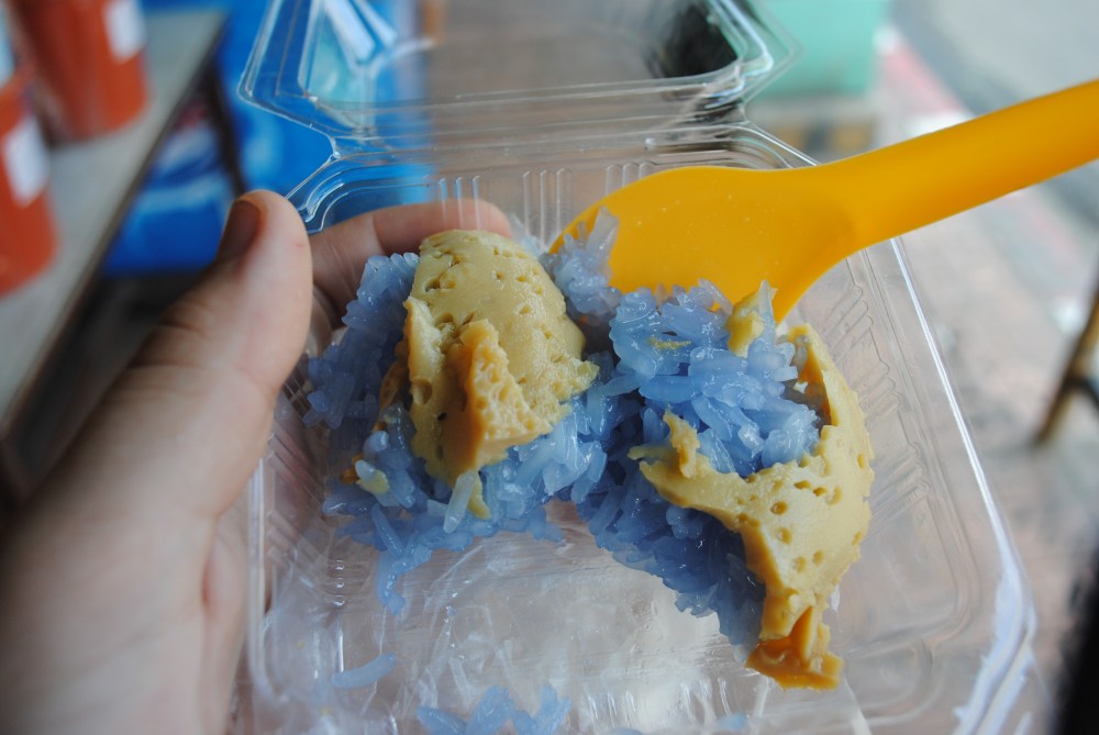 BLUE sticky rice with an unknown sweet foamy substance